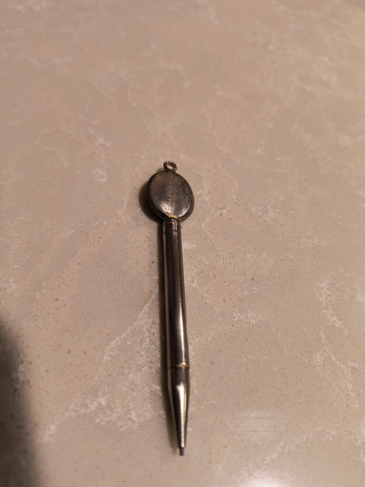 Mini mechanical pencil pendant designed to hold photo. 3″ Long. Nichel Chrome.