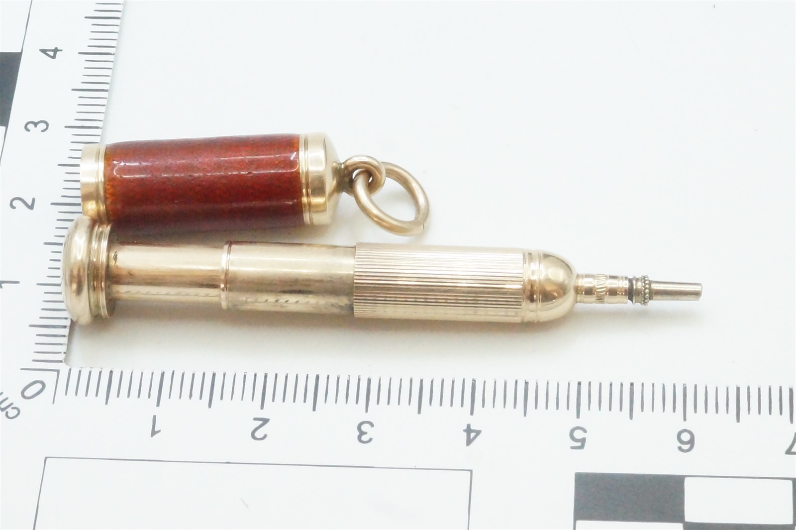 ANTIQUE ENGLISH 9k GOLD ENAMEL ‘MAGIC’ BULLET PENCIL FOB CHARM c1900
