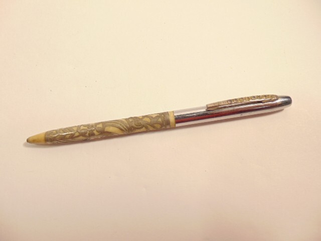 older unlabeled mechanical pencil with jeweled pocket clip & filigree accent