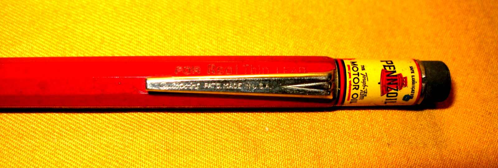 PRE-OWNED 76 AUTOPOINT MECHANICAL PENCIL MAROON PENCIL W/PENNZOIL ADV.
