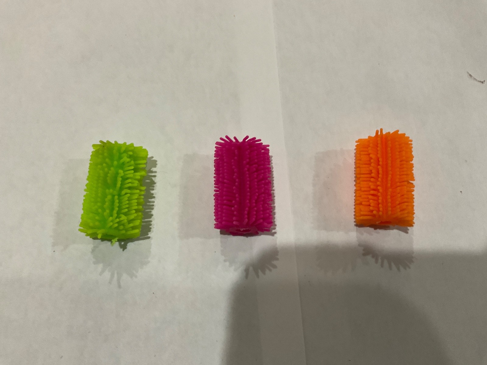 3 silicone pencil grippers. Soft, flexible, and have vibrant colors