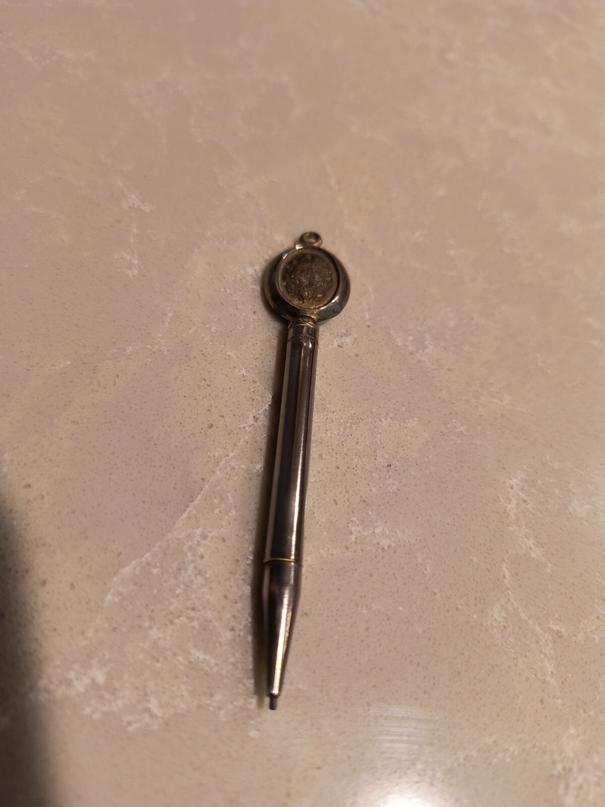 Mini mechanical pencil pendant designed to hold photo. 3″ Long. Nichel Chrome.