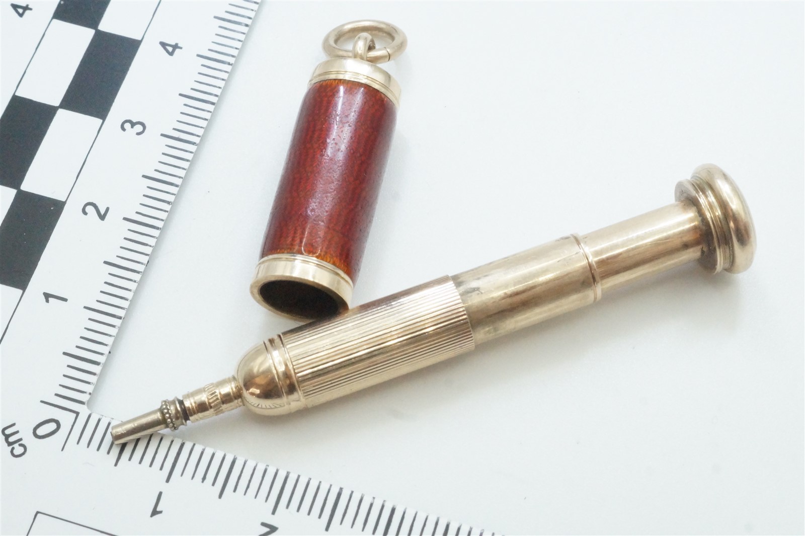ANTIQUE ENGLISH 9k GOLD ENAMEL ‘MAGIC’ BULLET PENCIL FOB CHARM c1900